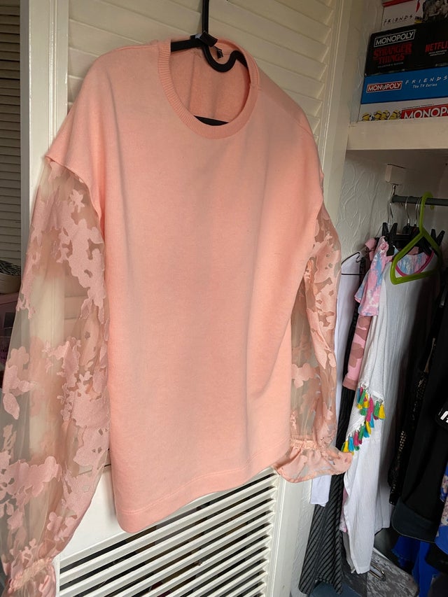 Peach coloured sweatshirt