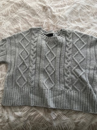 A pack of three sweaters
