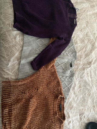 A pack of three sweaters