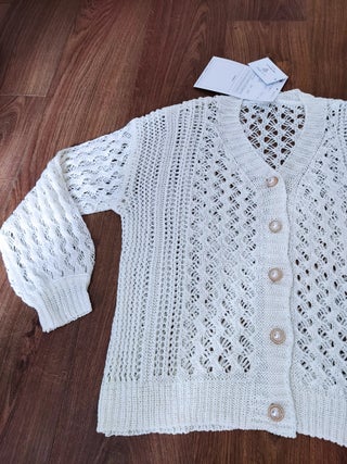 Buttoned cream knitted cardigan