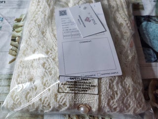 Buttoned cream knitted cardigan