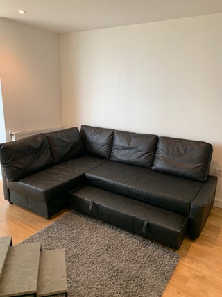 Corner sofa-bed with storage